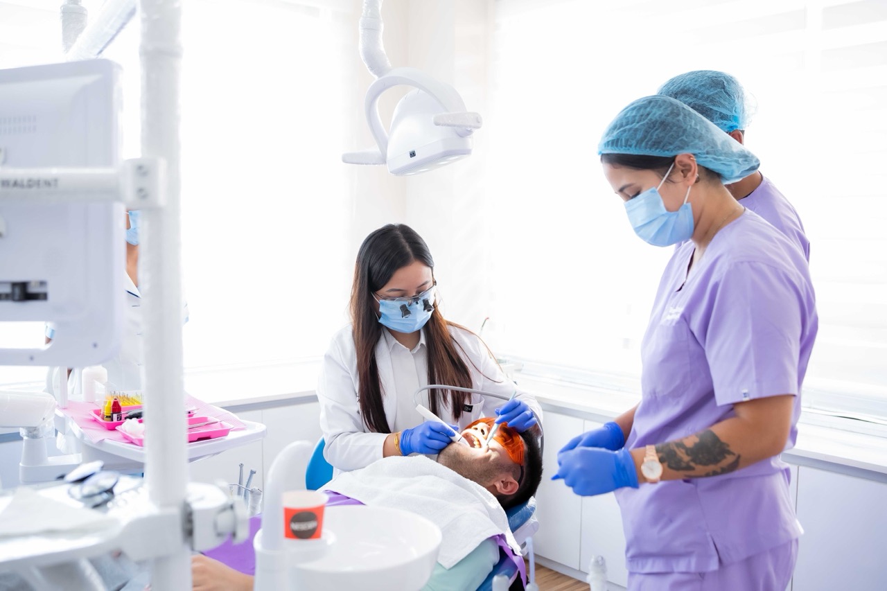 Patient receiving smile makeover at Aura Dental & Aesthetic Clinic